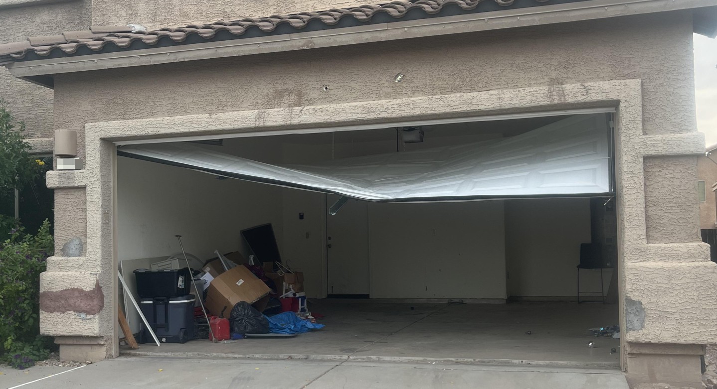 Tucson garage door in need of serious help Tucson garage door in need of serious help